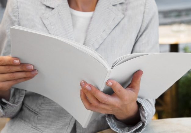 close-up-woman-reading-mock-up-magazine_23-2148295561